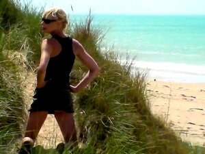 Slender Blonde Milf Gives A Wonderful Handjob On The Beach